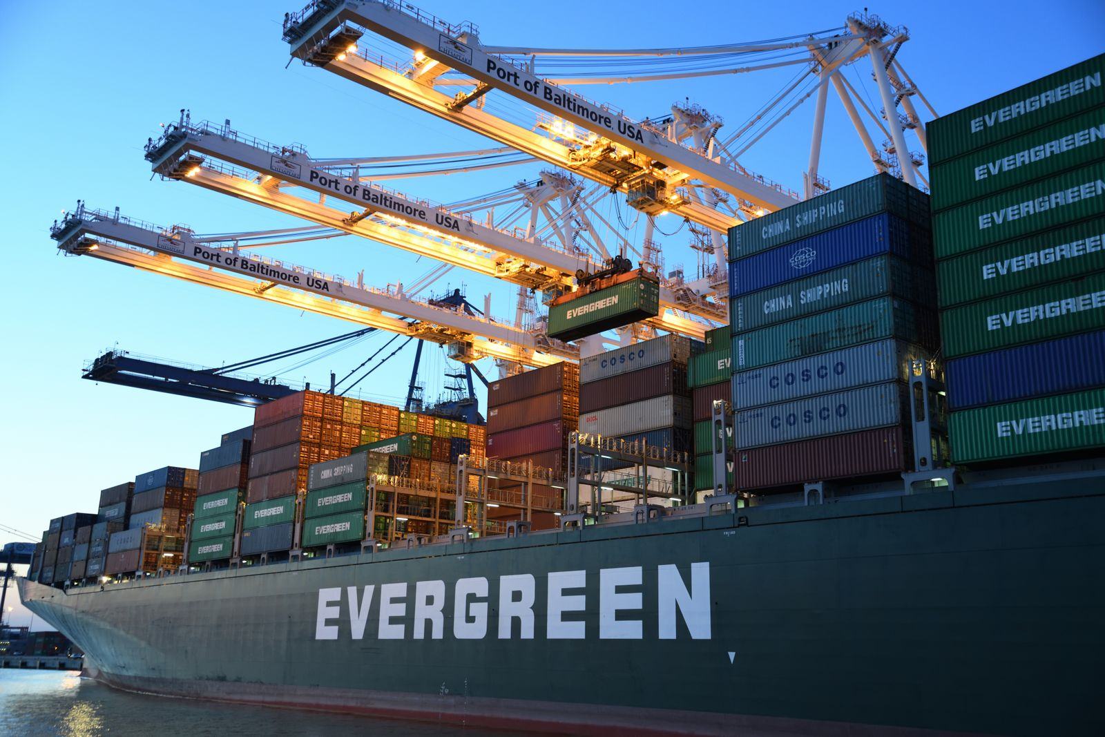 Gantry cranes loading containers onto a vessel
